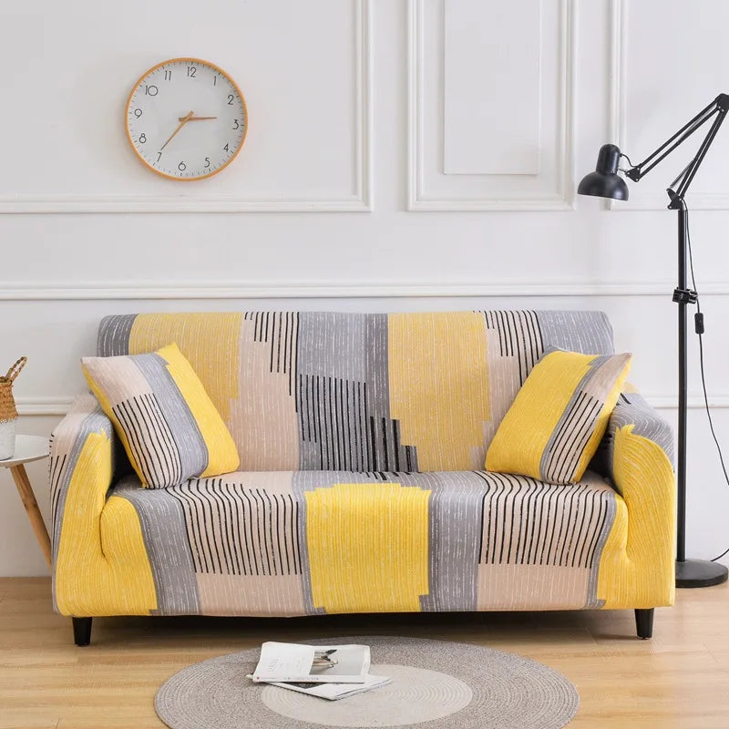 Housse de canapé extensible à motifs géométriques jaunes et gris dans un salon moderne