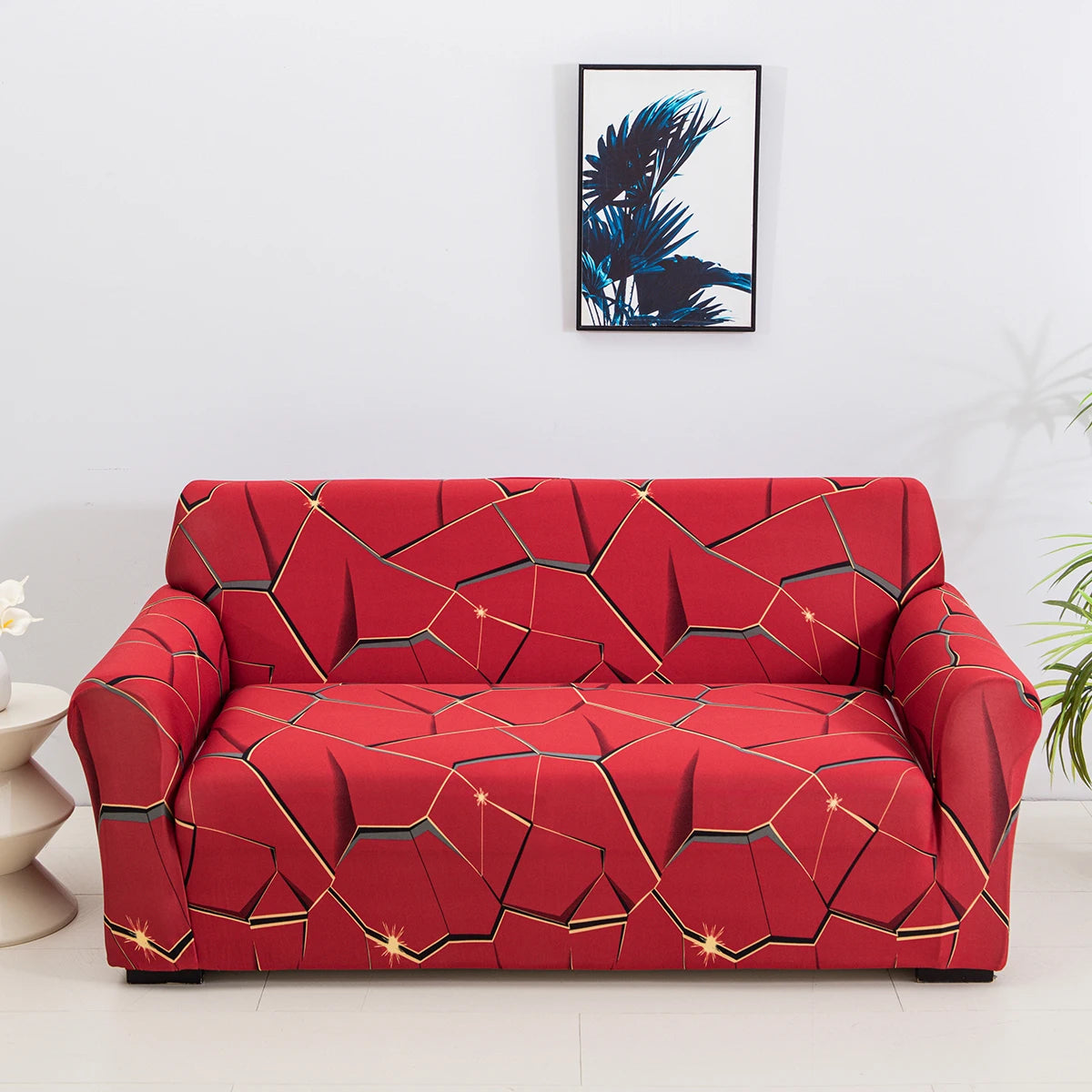 Housse de canapé extensible rouge avec motifs géométriques dorés