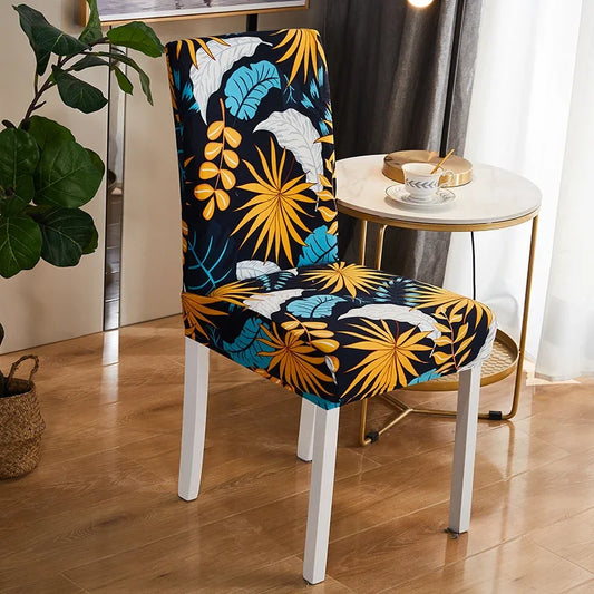 Housse de chaise extensible à motif tropical avec feuilles jaunes, bleues et blanches