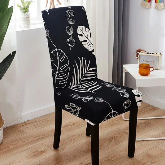 Housse de chaise extensible noire avec motif végétal blanc – design élégant et moderne