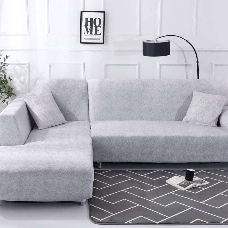 Housse extensible pour canapé d’angle couleur gris clair unie
