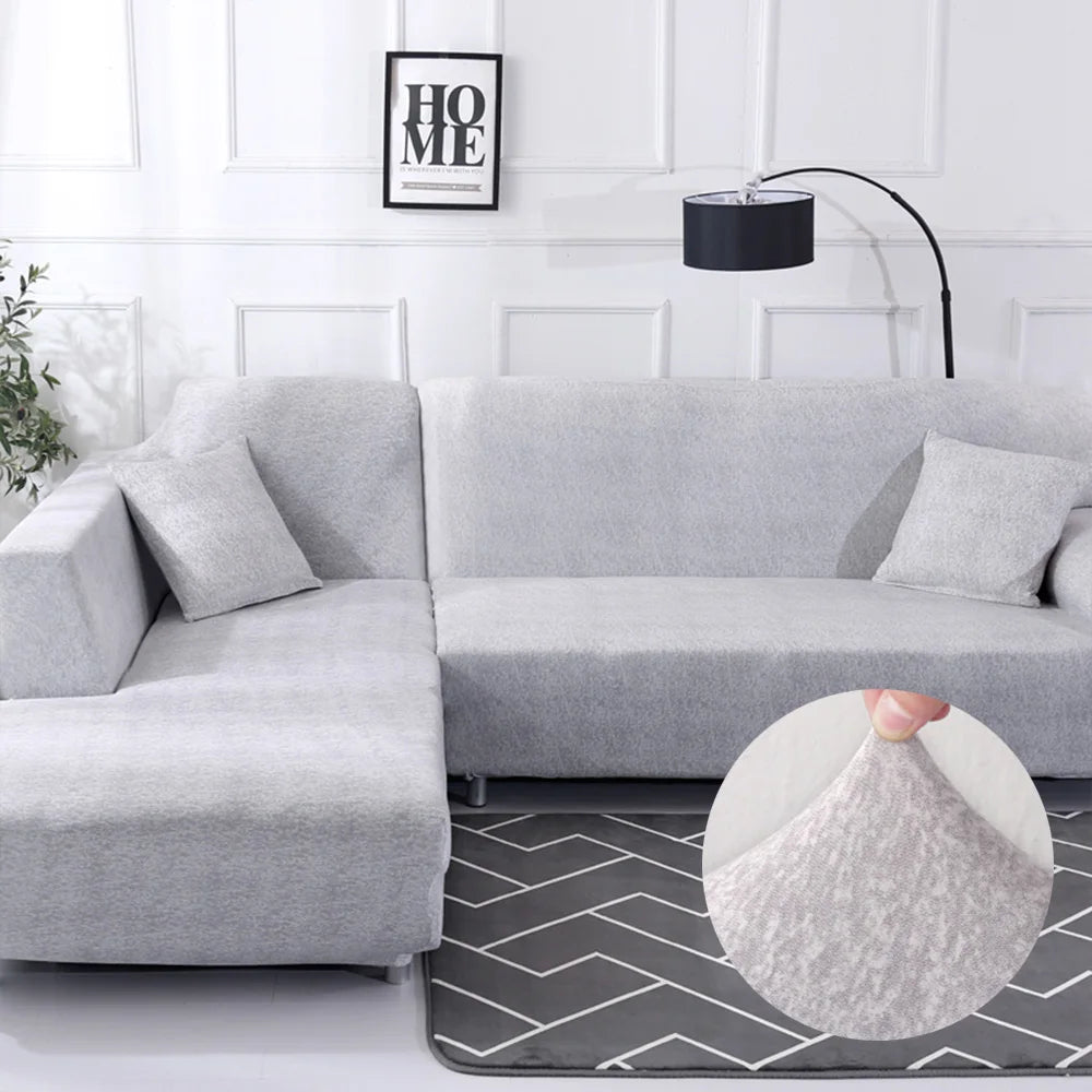 Housse extensible pour canapé d’angle couleur gris clair unie