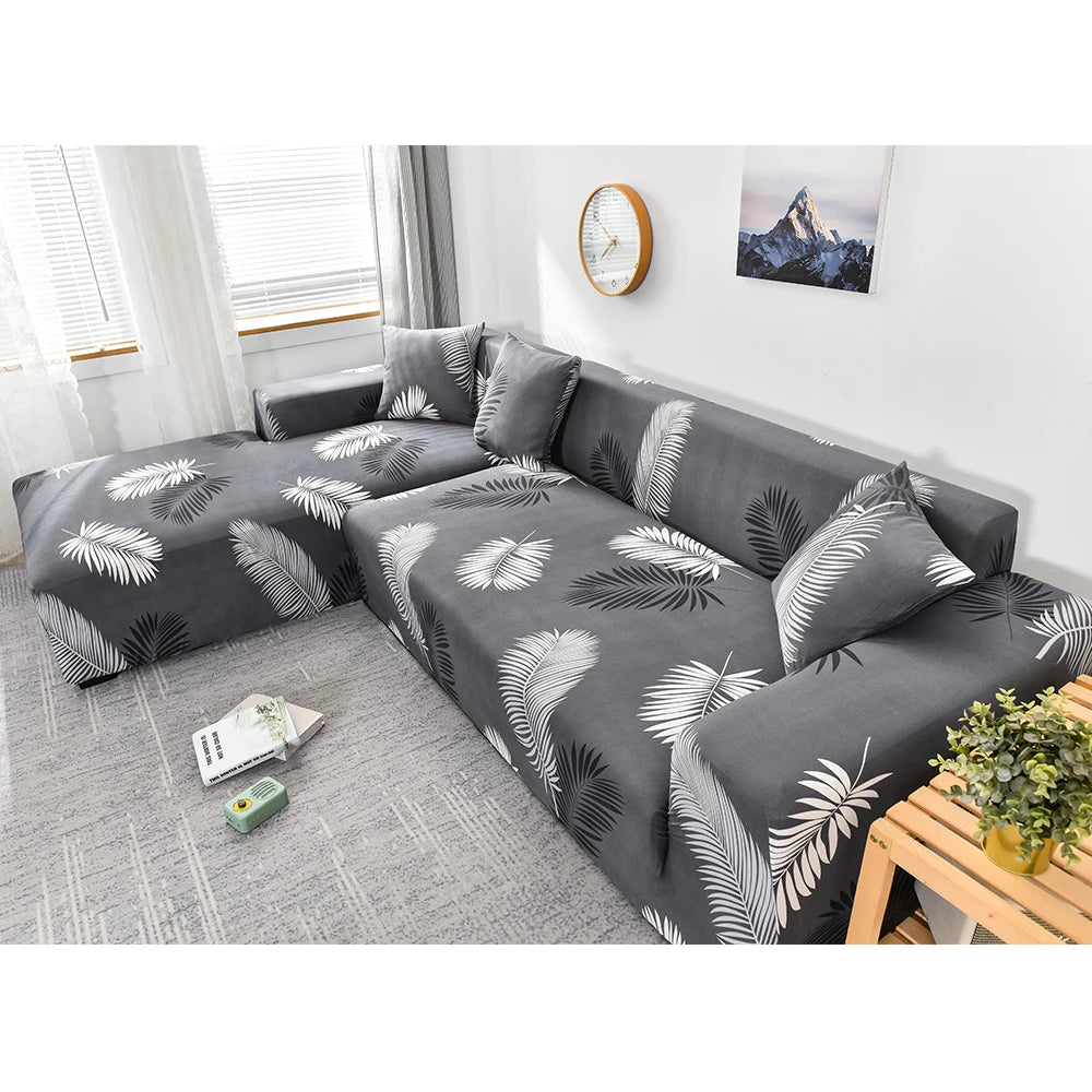 housse de canapé d’angle extensible gris foncé avec motif feuilles tropicales blanches