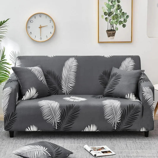 Housse de canapé grise avec motif feuilles tropicales blanches et noires
