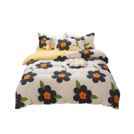 Housse de couette crème imprimée de grandes fleurs noires à cœur orange et feuilles vertes, avec envers en vichy jaune, sur un lit double moderne.