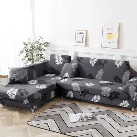 housse de canapé d’angle extensible gris foncé avec motif feuilles tropicales blanches